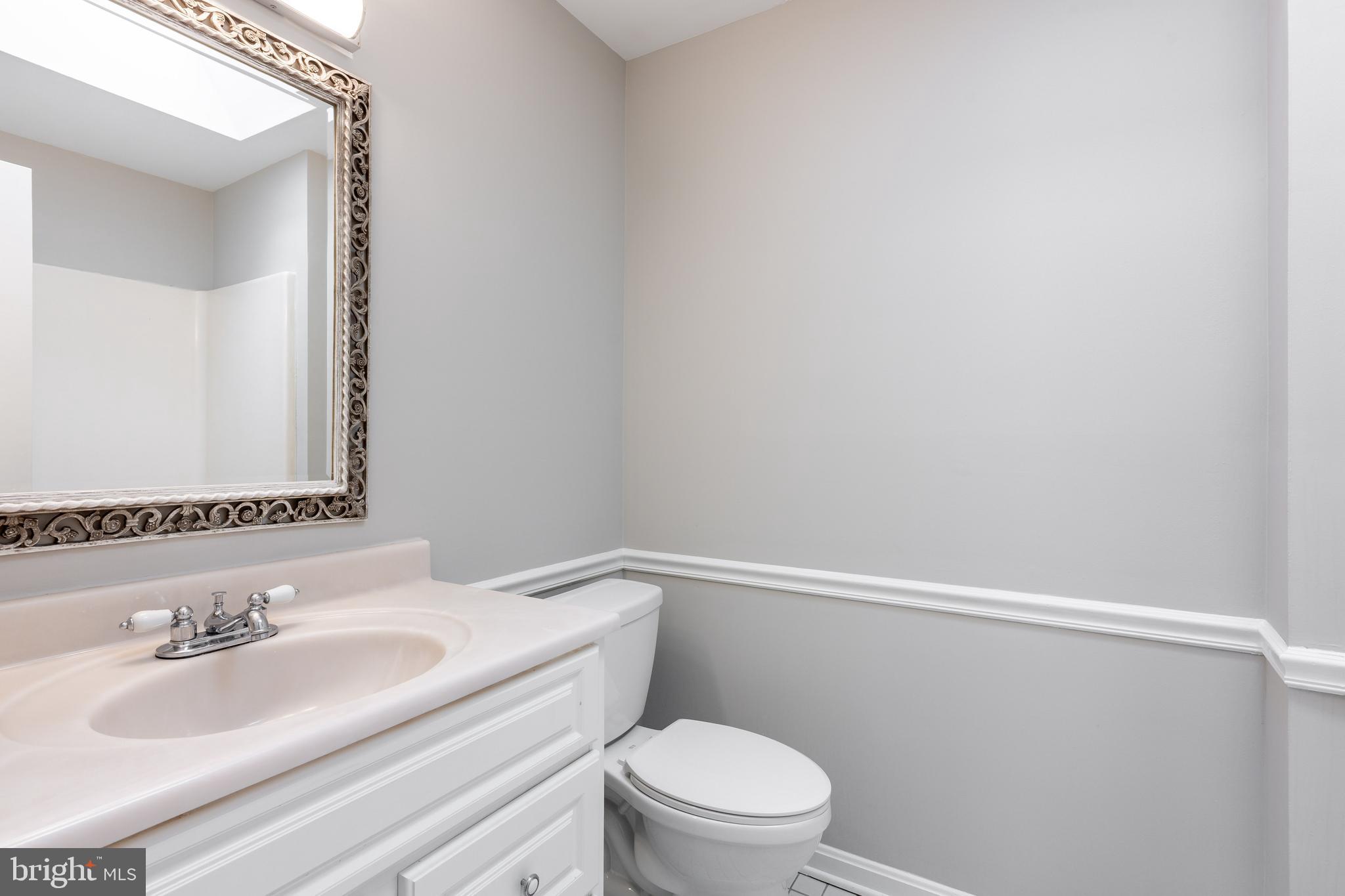 2212 Blue Valley Drive Silver Spring, MD 20904 - Photo 33 of 61 a bathroom with a sink a toilet and vanity