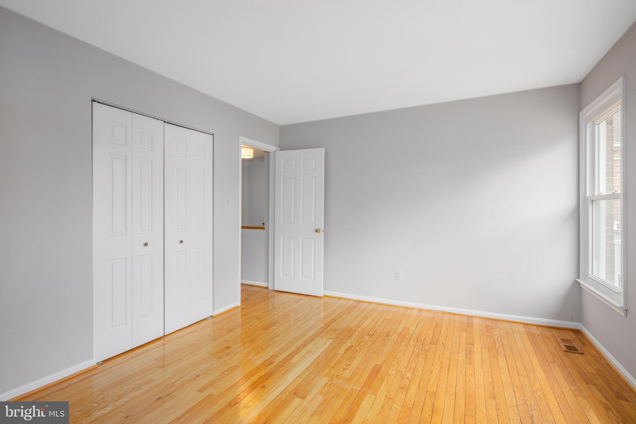 2212 Blue Valley Drive Silver Spring, MD 20904 - Photo 36 of 61 a view of empty room with wooden floor