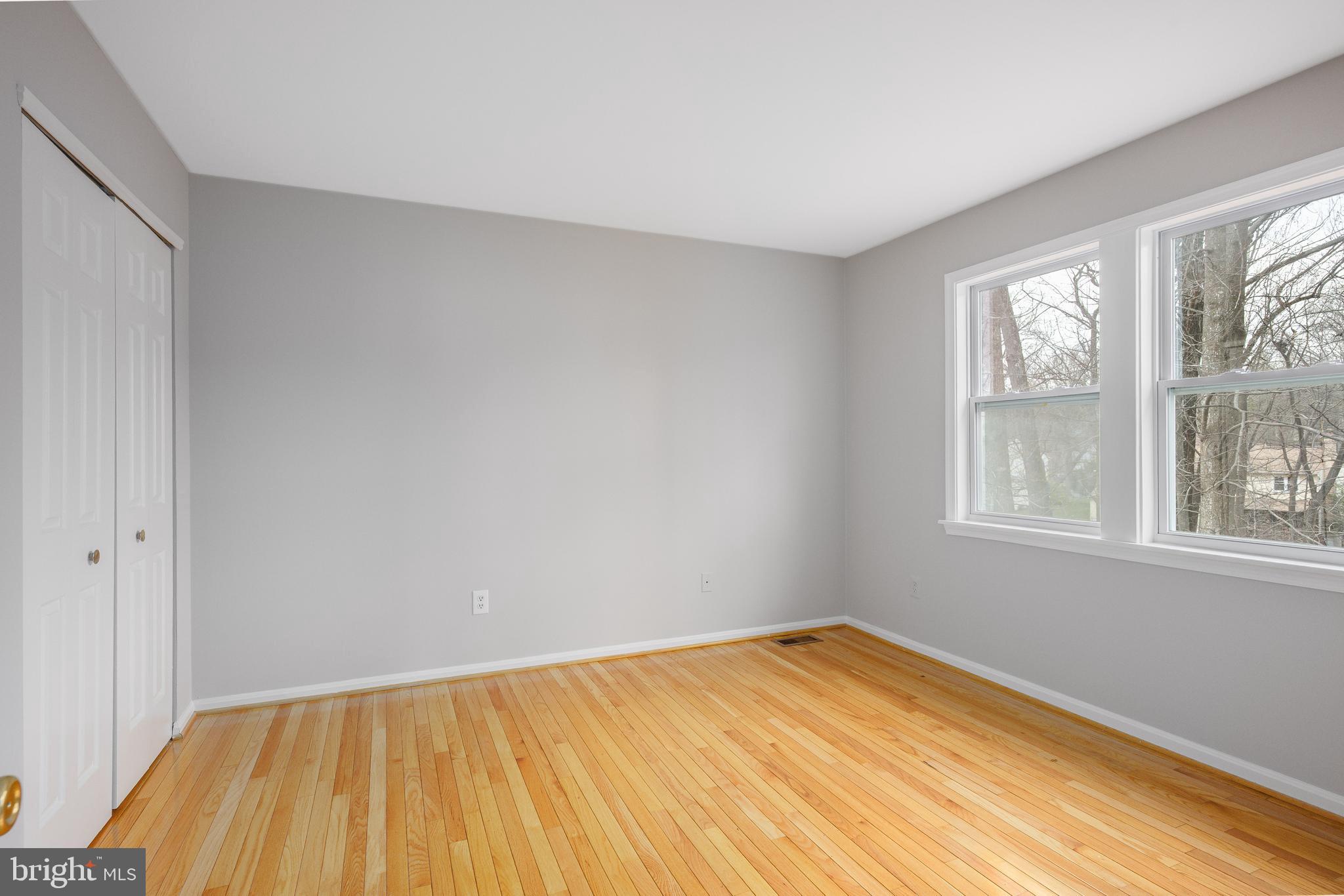 2212 Blue Valley Drive Silver Spring, MD 20904 - Photo 38 of 61 a view of empty room with wooden floor and fan