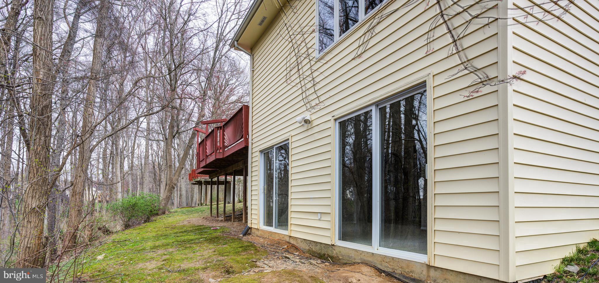 2212 Blue Valley Drive Silver Spring, MD 20904 - Photo 60 of 61 a view of a house with a large window and wooden fence