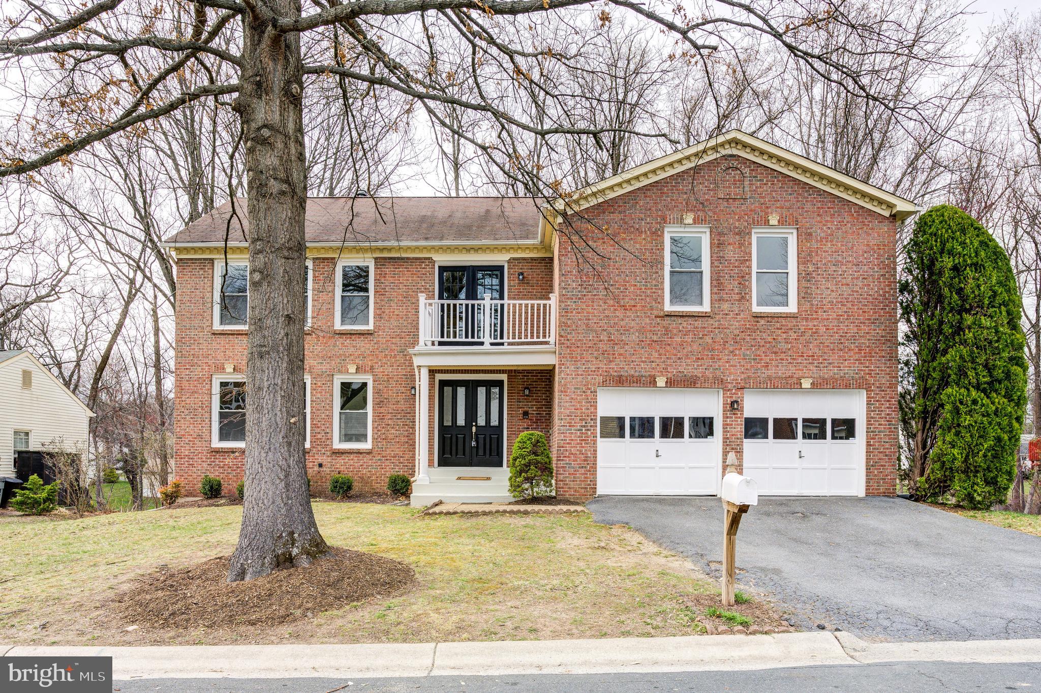 2212 Blue Valley Drive Silver Spring, MD 20904 - Photo 6 of 61 a front view of a house with garden