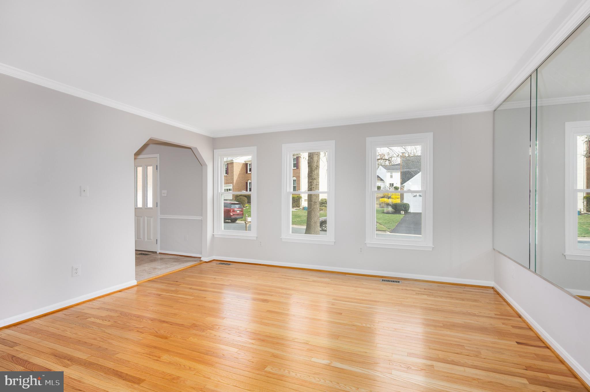 2212 Blue Valley Drive Silver Spring, MD 20904 - Photo 8 of 61 an empty room with wooden floor and windows