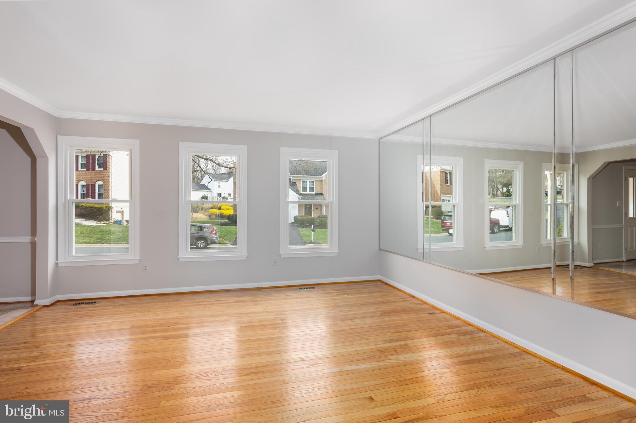 2212 Blue Valley Drive Silver Spring, MD 20904 - Photo 9 of 61 a view of an empty room with window and wooden floor