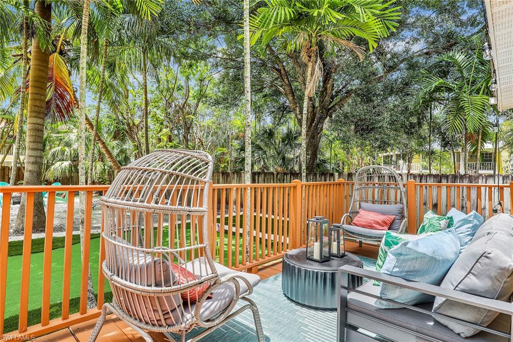 2780 Weeks Avenue Naples, FL 34112 - Photo 22 of 34 a view of a chairs and table in backyard