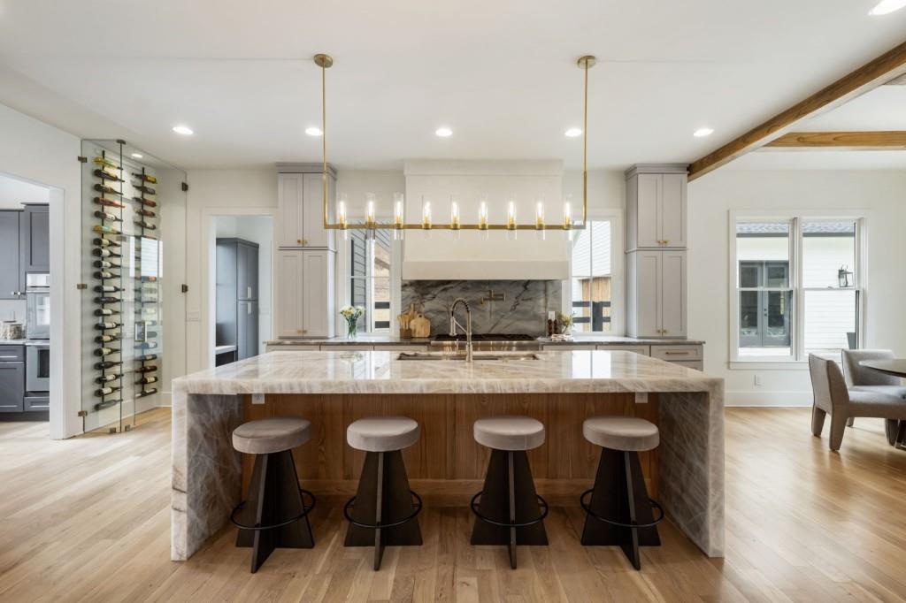 1980 Birmingham Road Milton, GA 30004 - Photo 17 of 78 a kitchen with kitchen island granite countertop a table chairs sink and cabinets