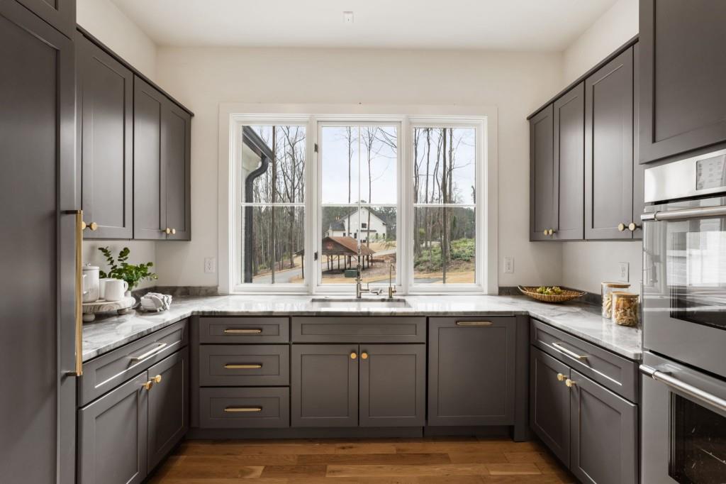 1980 Birmingham Road Milton, GA 30004 - Photo 24 of 78 a kitchen with a sink cabinets and window