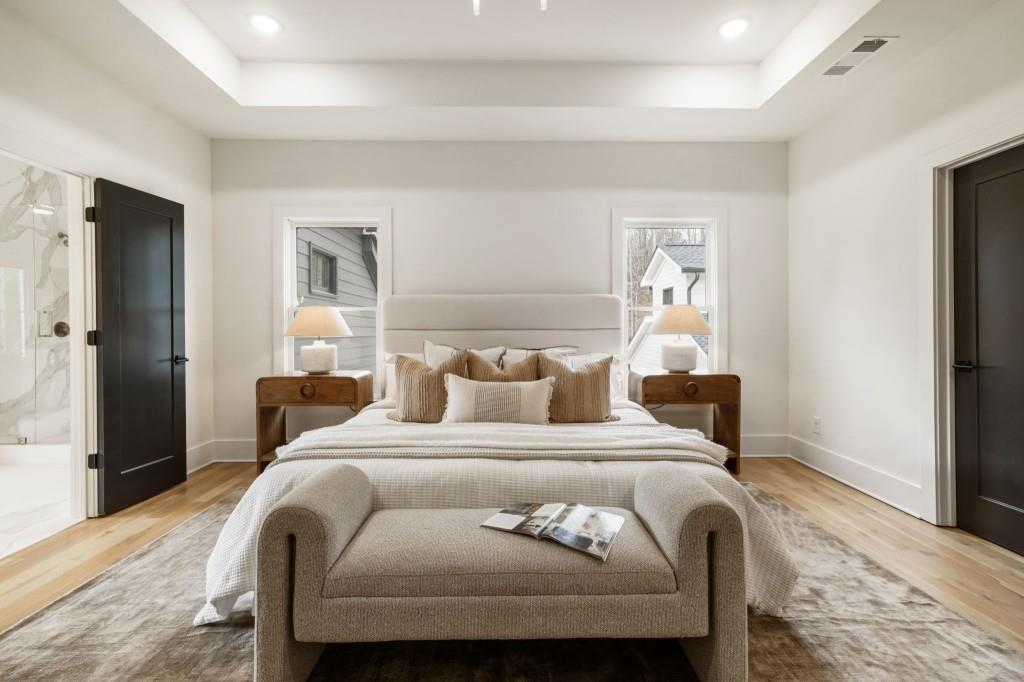 1980 Birmingham Road Milton, GA 30004 - Photo 37 of 78 a bedroom with a bed and wooden floor