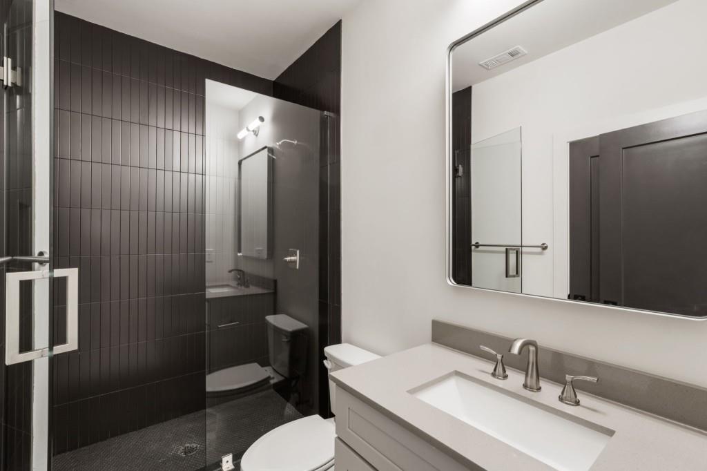 1980 Birmingham Road Milton, GA 30004 - Photo 45 of 78 a bathroom with a sink toilet and shower