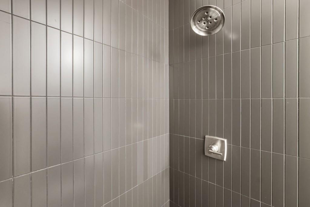 1980 Birmingham Road Milton, GA 30004 - Photo 46 of 78 a bathroom with a shower curtain and a window