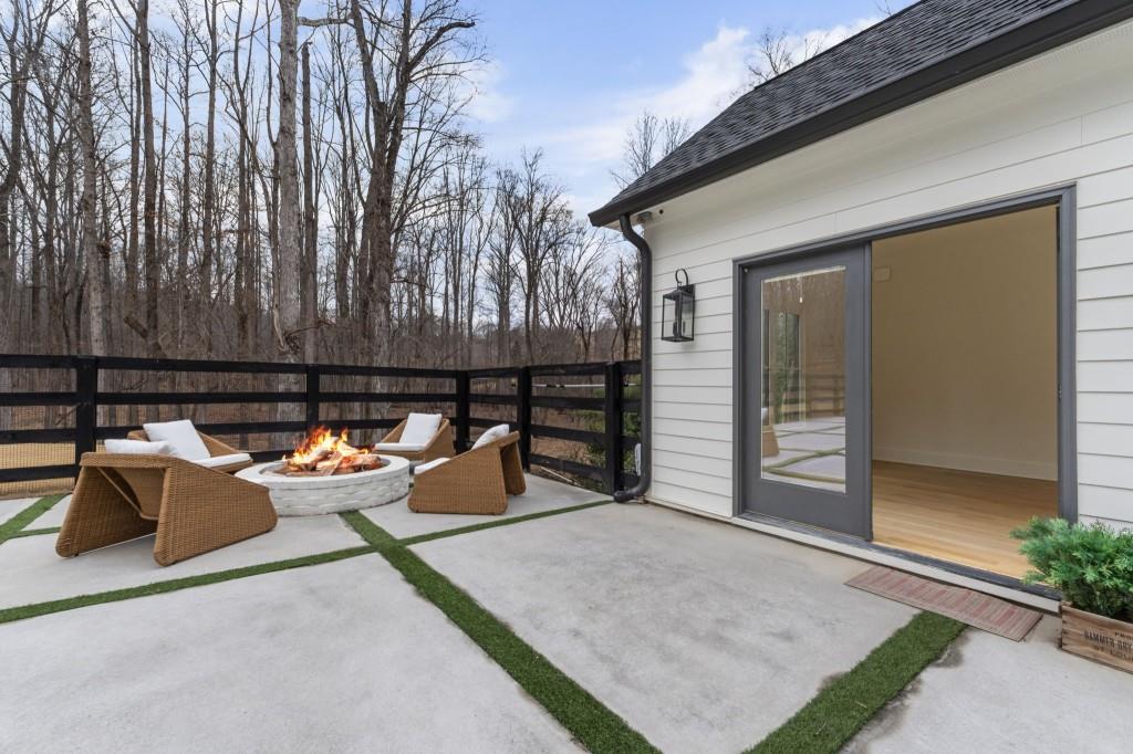 1980 Birmingham Road Milton, GA 30004 - Photo 64 of 78 a view of a patio with a couple of couches and potted plants