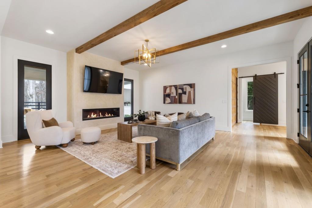 1980 Birmingham Road Milton, GA 30004 - Photo 10 of 78 a living room with furniture and a flat screen tv