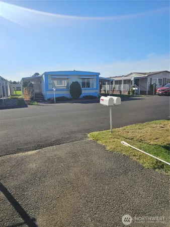 a living room with a couch and cabinets