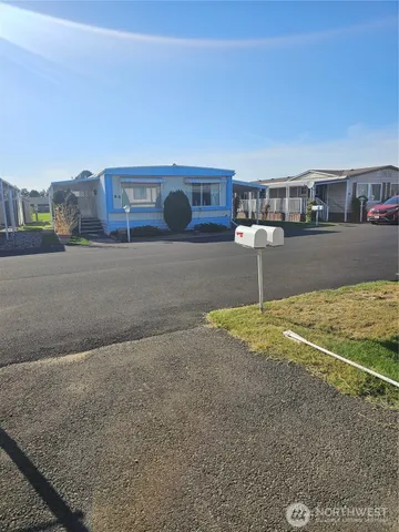 a living room with a couch and cabinets