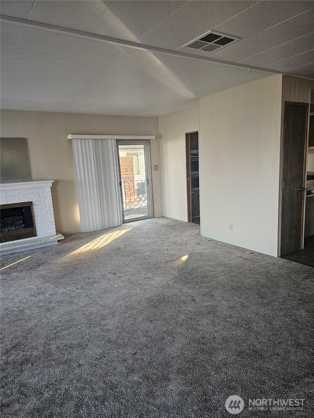 66 Jade Street Walla Walla, WA 99362 - Photo 2 of 10 a view of a livingroom with a fireplace and window