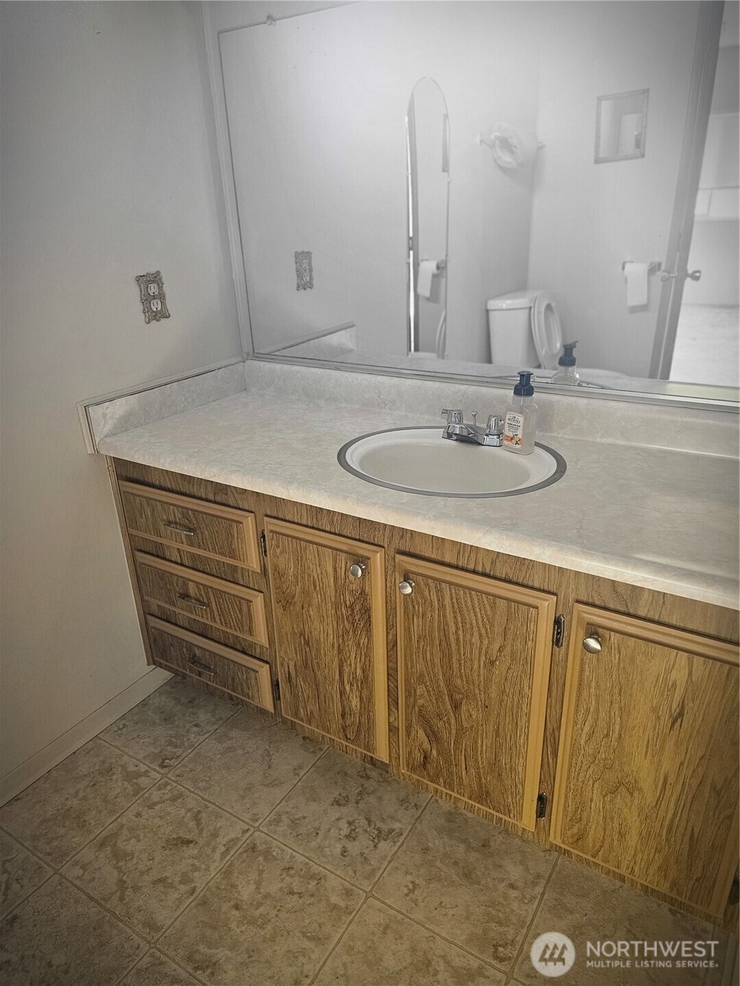 66 Jade Street Walla Walla, WA 99362 - Photo 7 of 10 a bathroom with a sink and a mirror