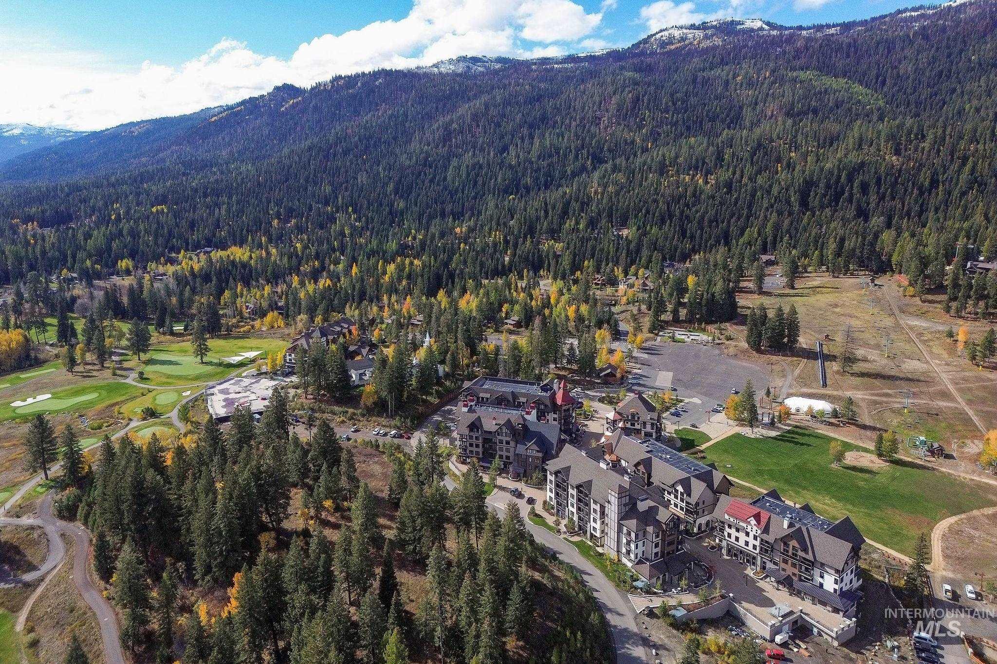 720 Village Drive, Unit 311 Donnelly, ID 83615 - Photo 35 of 37 Aerial view of property's location with mountains and a local golf course