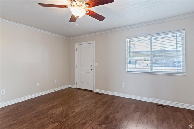 2350 South Highway 89, Unit 4 Perry, UT 84302 - Photo 6 of 30 Empty room featuring a ceiling fan, dark wood-style flooring, and crown molding