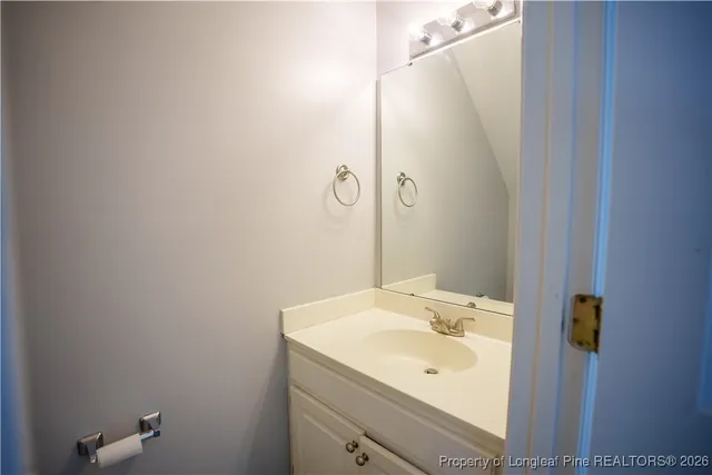 a bathroom with a sink and mirror