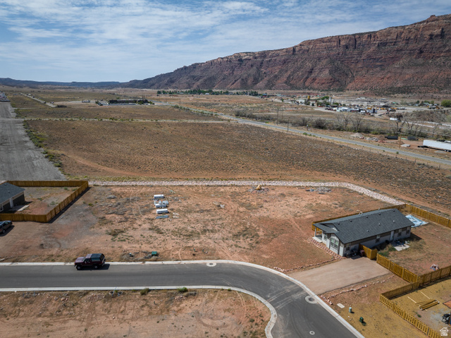 212 Lidia Circle, Unit 17 Moab, UT 84532 - Photo 23 of 24 Aerial perspective showcasing a cul-de-sac lot with mountain backdrop