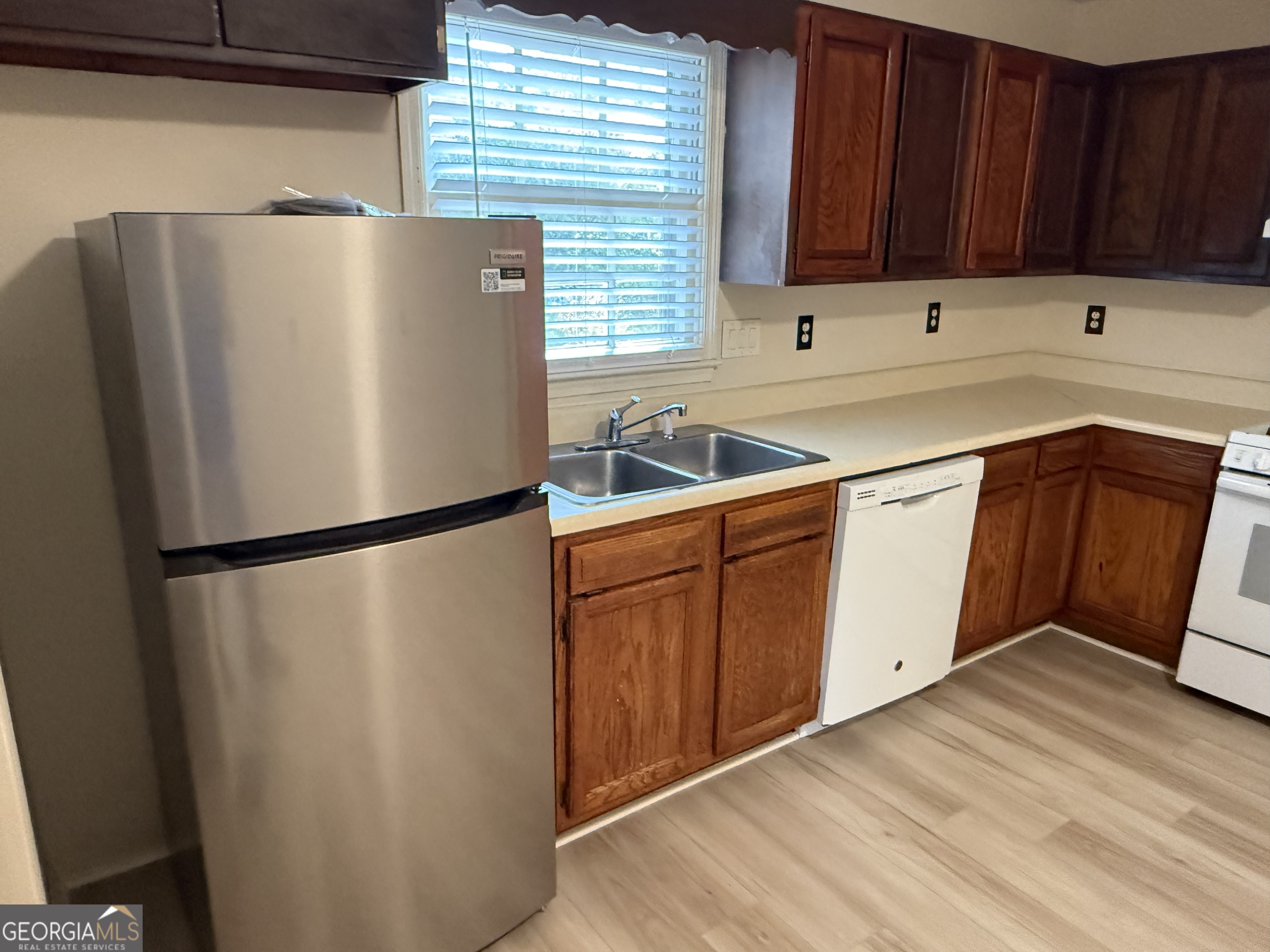 1832 King George Lane Southwest Atlanta, GA 30331 - Photo 12 of 28 a white refrigerator freezer sitting in a kitchen