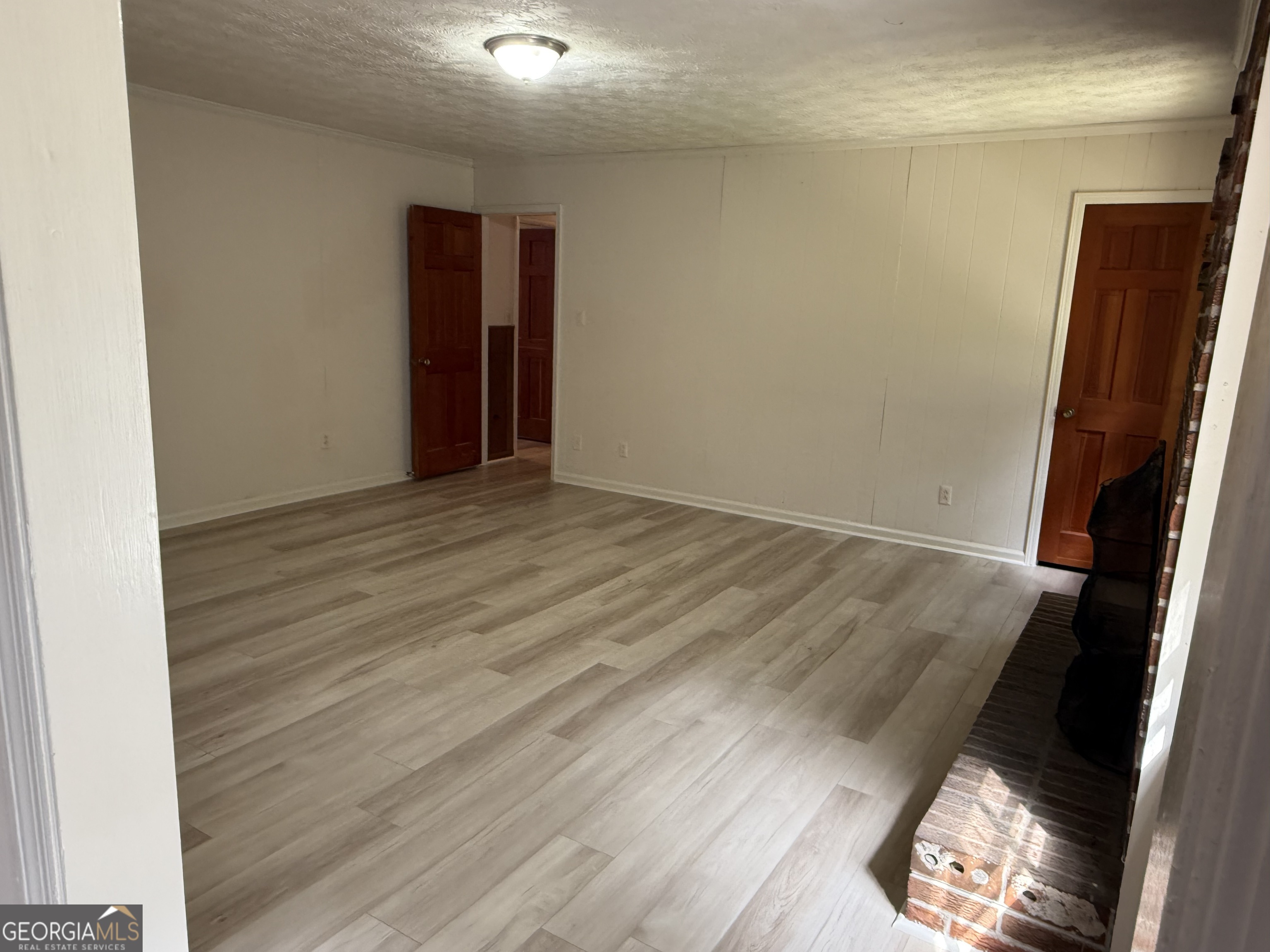 1832 King George Lane Southwest Atlanta, GA 30331 - Photo 14 of 28 an empty room with wooden floor and closet