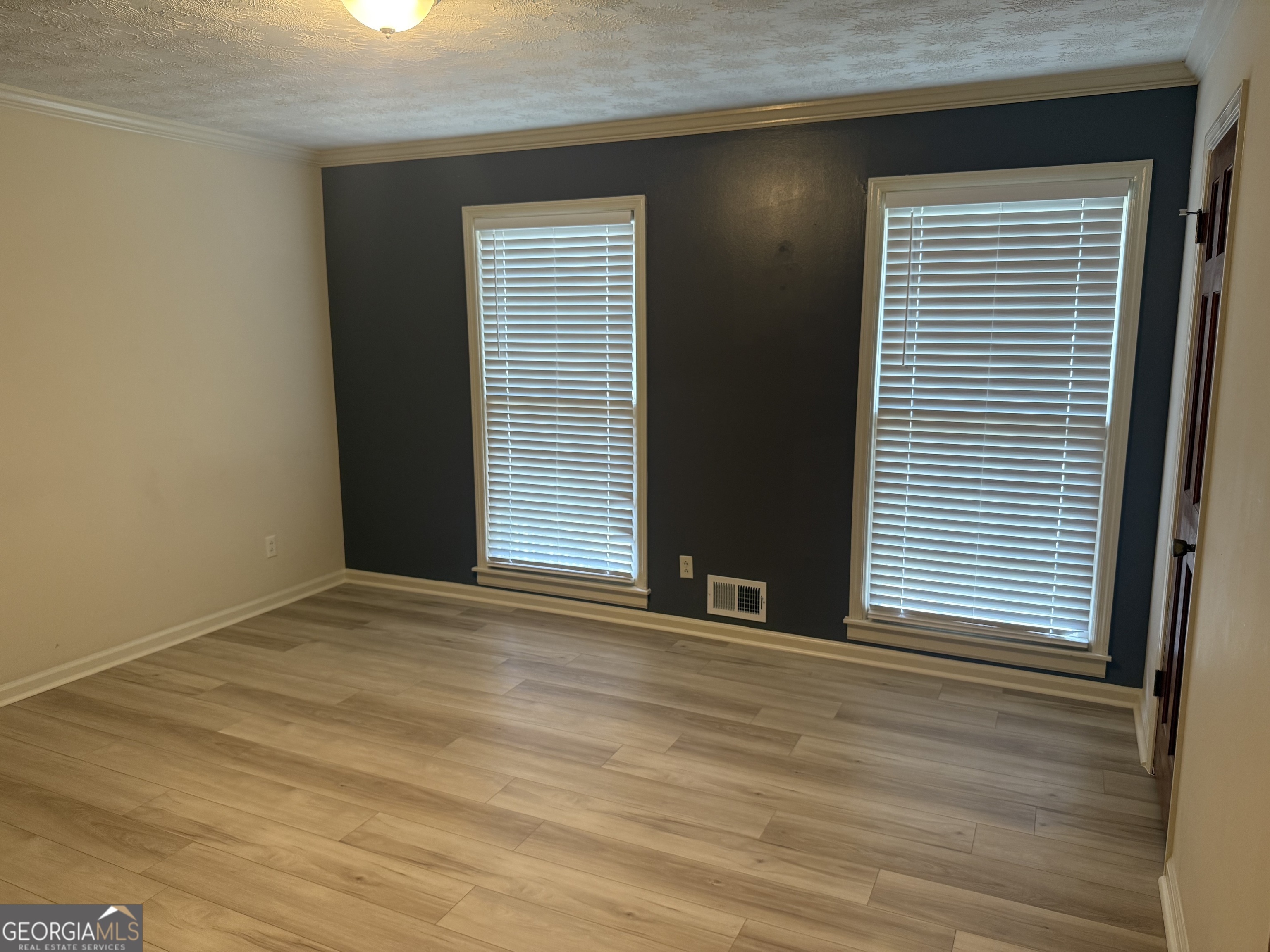 1832 King George Lane Southwest Atlanta, GA 30331 - Photo 20 of 28 an empty room with wooden floor and a window