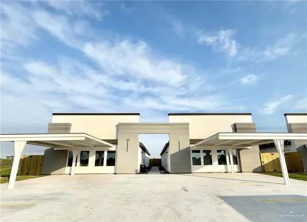 a view of building with glass windows