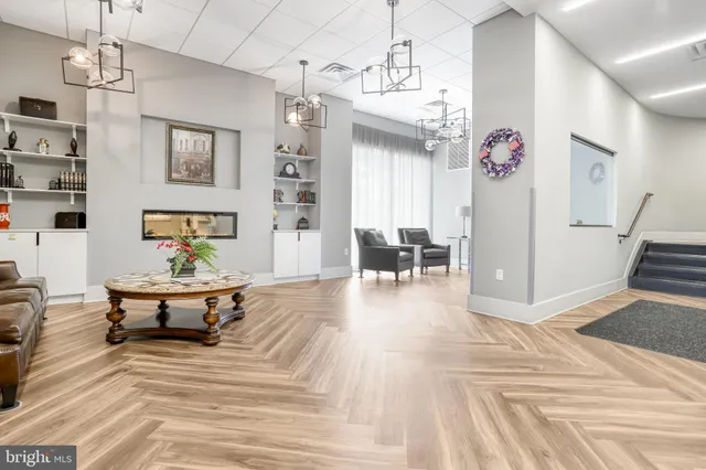 a living room with furniture and a table