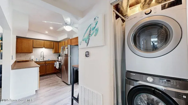 a view of a kitchen with washer and dryer