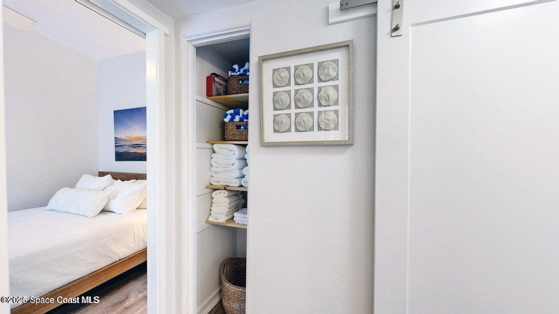 701 South Orlando Avenue, Unit A Cocoa Beach, FL 32931 - Photo 10 of 13 a bedroom with a bed and a window