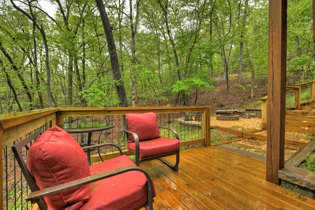 a sitting area with furniture on wooden deck