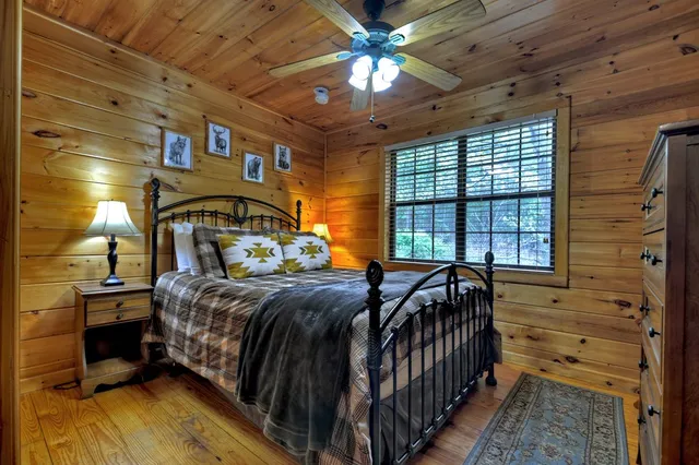 a kitchen with granite countertop wooden cabinets a sink and dishwasher