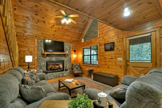 a view of a porch with furniture and wooden floor