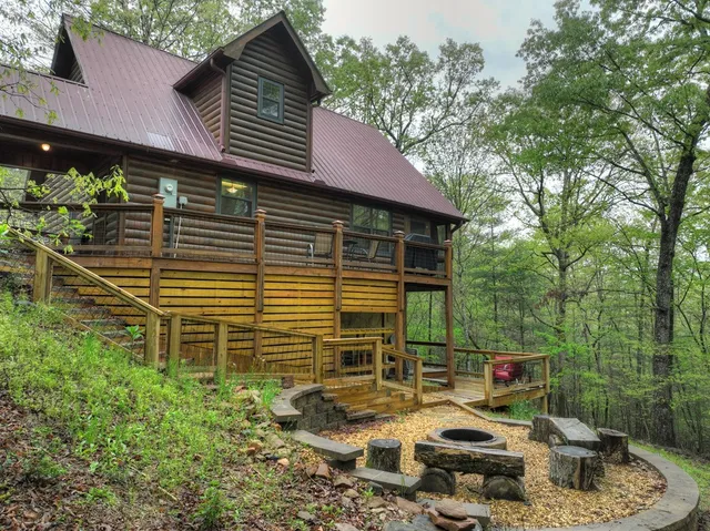a backyard of a house with outdoor seating