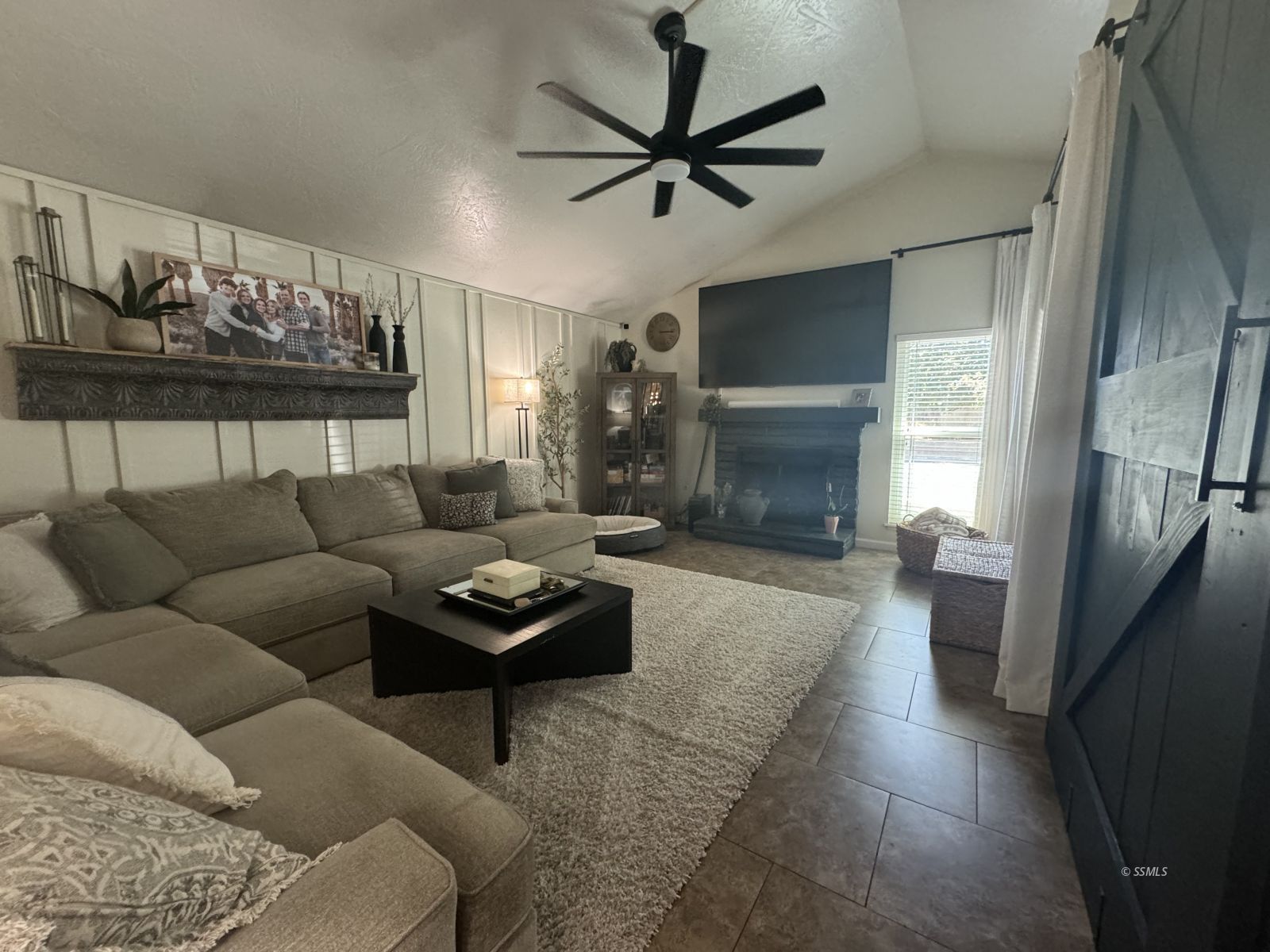 1024 Las Cruces Avenue Ridgecrest, CA 93555 - Photo 4 of 37 a living room with furniture a fireplace and a flat screen tv