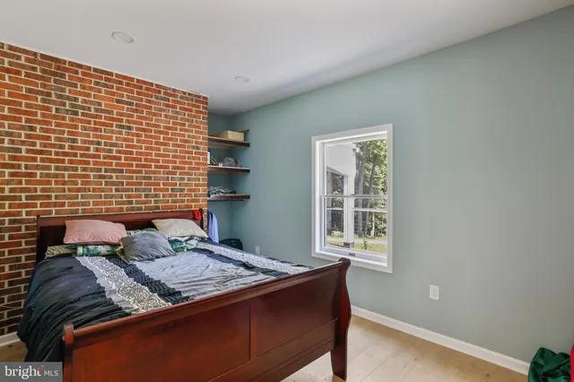 a bathroom with a tub shower and sink