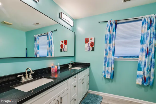 a bedroom with furniture and a rug