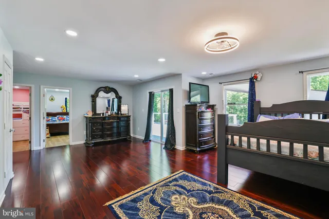 a room with toys and dresser with wooden floor