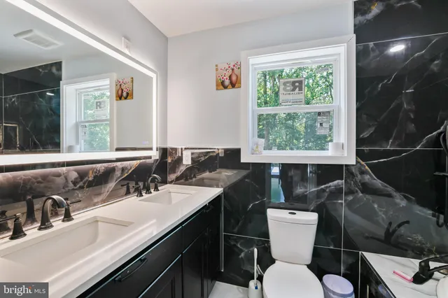 a bedroom with a bed and flat screen tv