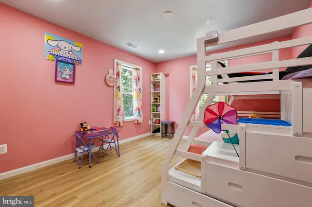a room with furniture and flat screen tv
