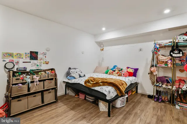 a backyard of a house with wooden floor fence and trees