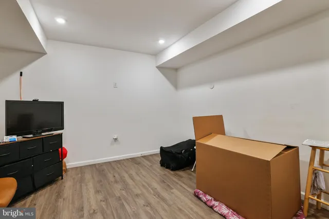a view of a patio with a table and chairs under an umbrella