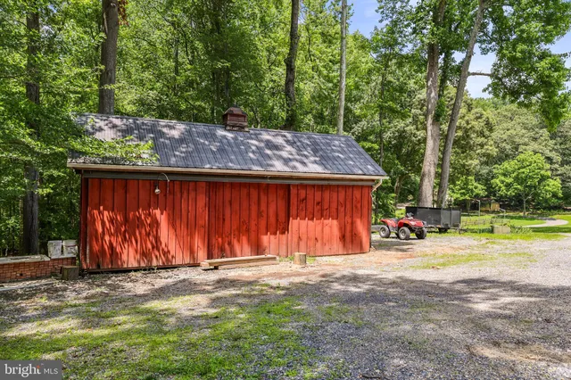 an aerial view of a house with swimming pool and big yard