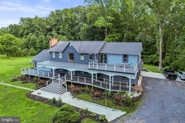 aerial view of a house with a yard