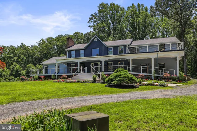 a view of a swimming pool with a yard