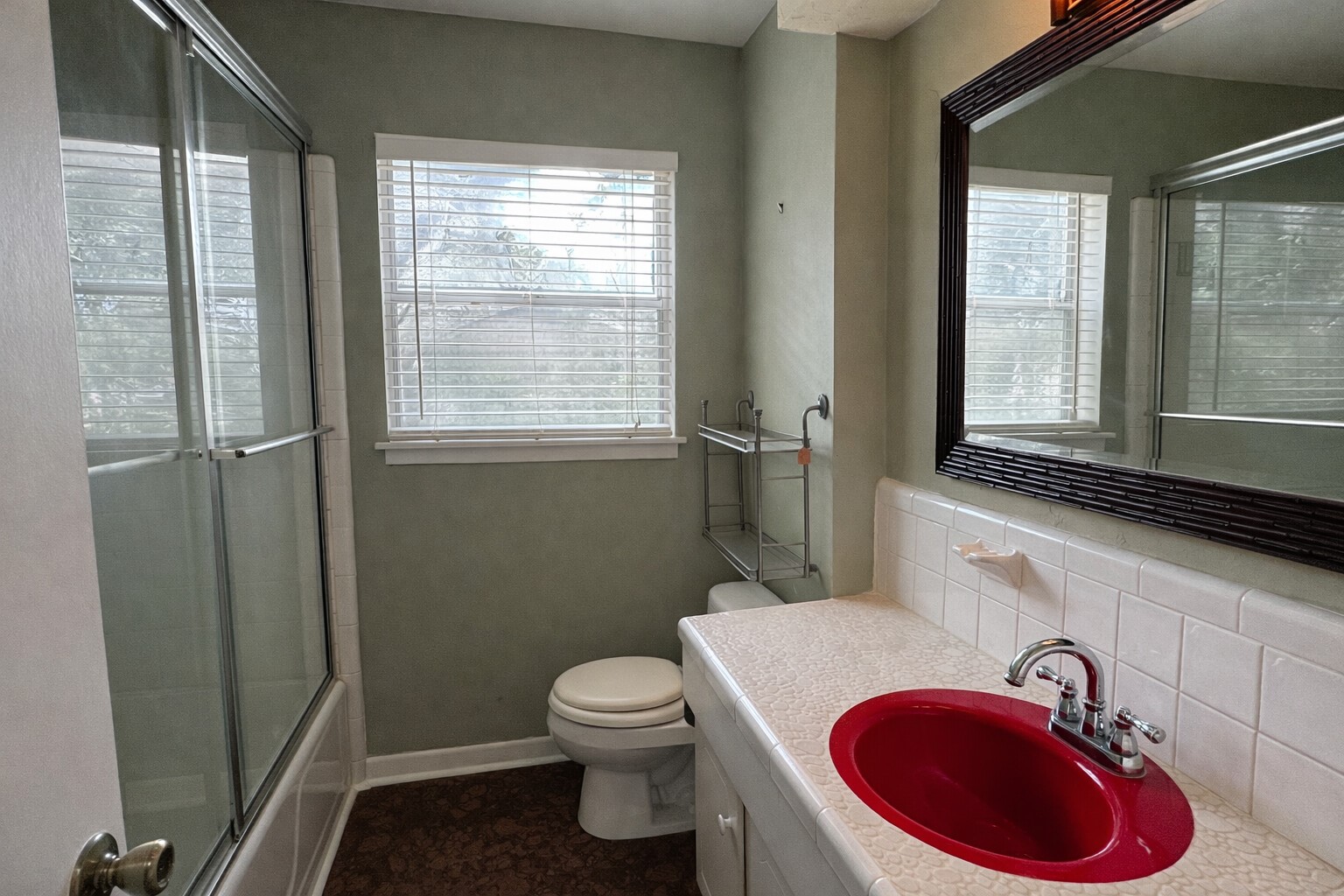 202 Hardy Street Bacliff, TX 77518 - Photo 14 of 21 a bathroom with a toilet sink and mirror