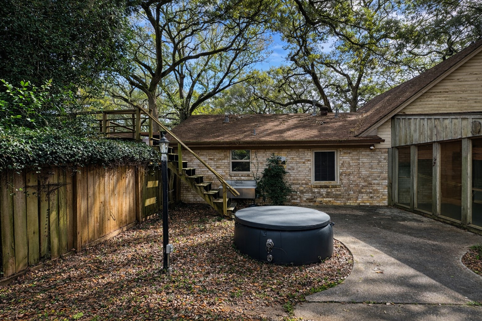 202 Hardy Street Bacliff, TX 77518 - Photo 17 of 21 a view of a backyard with table and chairs and a barbeque