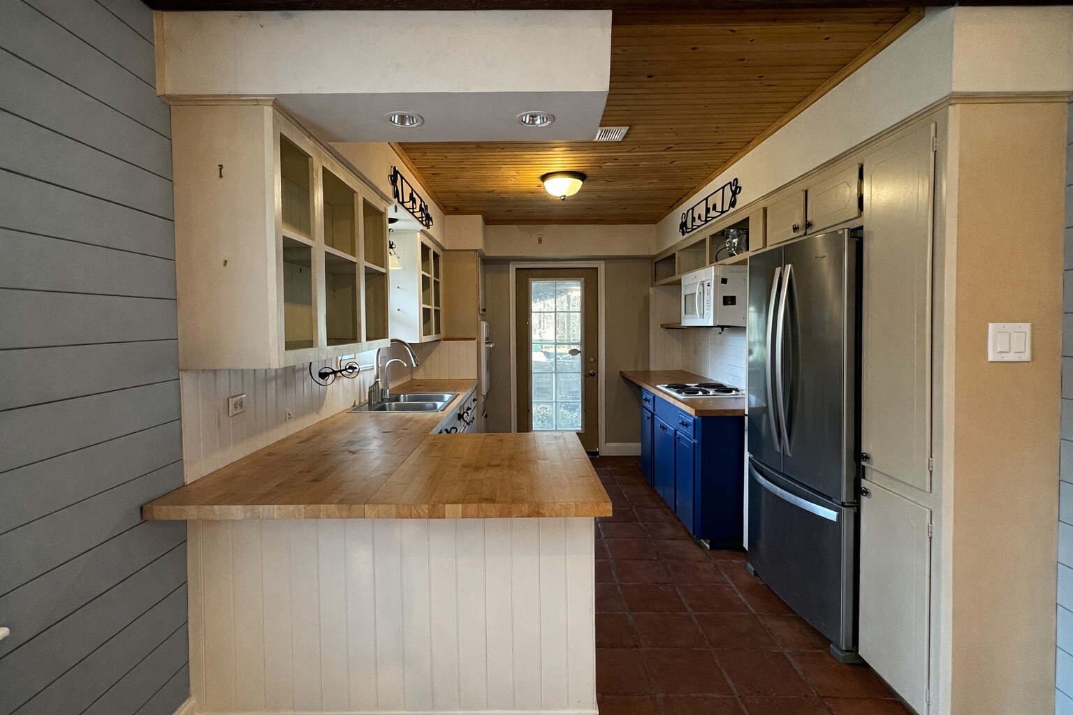 202 Hardy Street Bacliff, TX 77518 - Photo 6 of 21 a kitchen with stainless steel appliances granite countertop a sink and a refrigerator