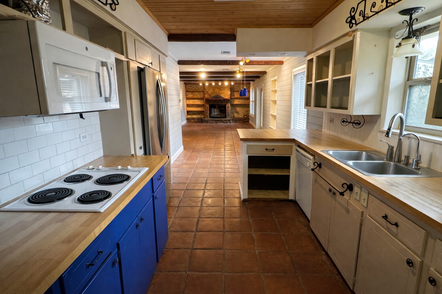 202 Hardy Street Bacliff, TX 77518 - Photo 8 of 21 a kitchen with stainless steel appliances a stove a sink and a refrigerator
