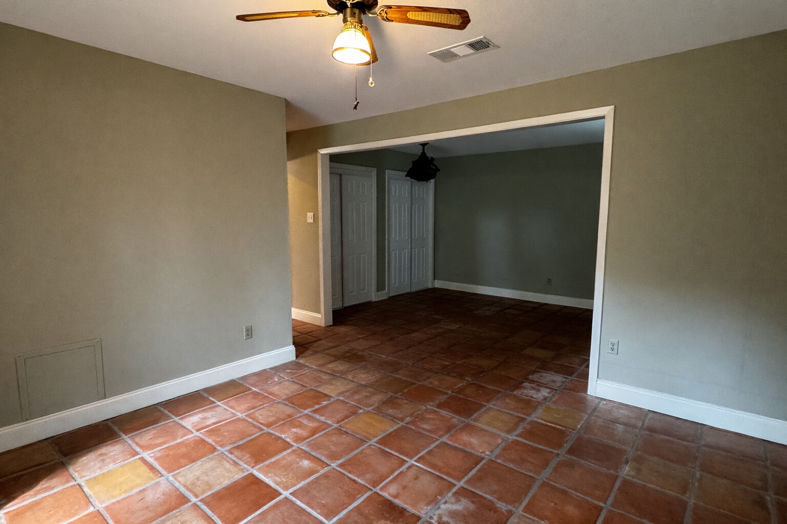 202 Hardy Street Bacliff, TX 77518 - Photo 9 of 21 an empty room with a chandelier fan and windows
